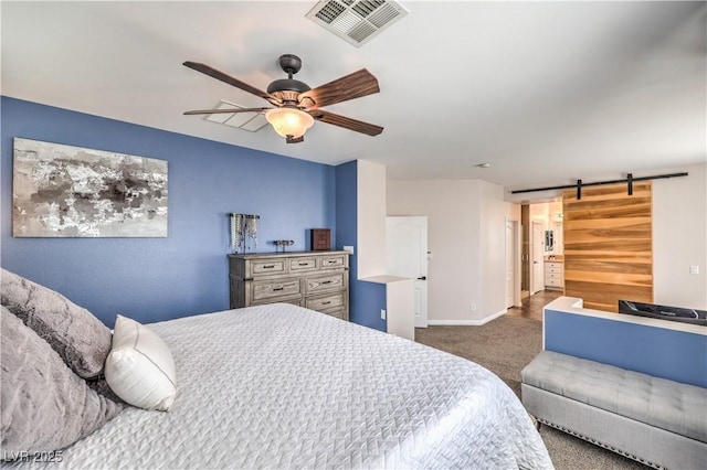 carpeted bedroom with visible vents, ceiling fan, a barn door, and baseboards