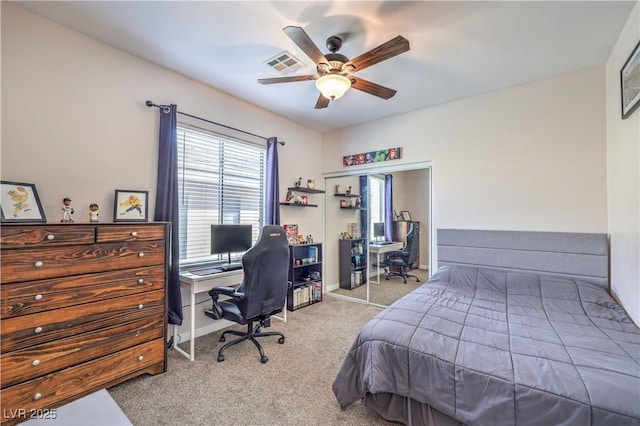 bedroom with carpet flooring, a ceiling fan, visible vents, and baseboards