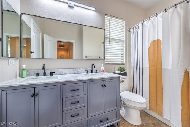 full bath with a shower with shower curtain, toilet, double vanity, and a sink