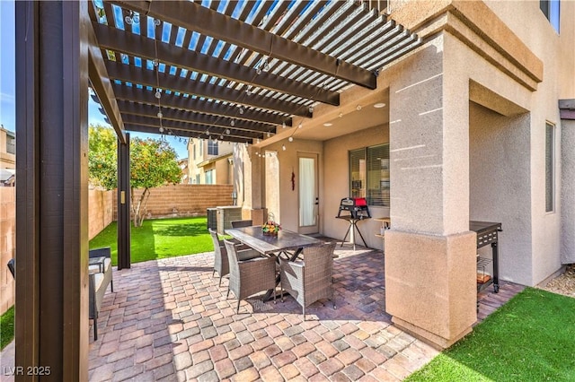 view of patio with fence, a pergola, and outdoor dining area