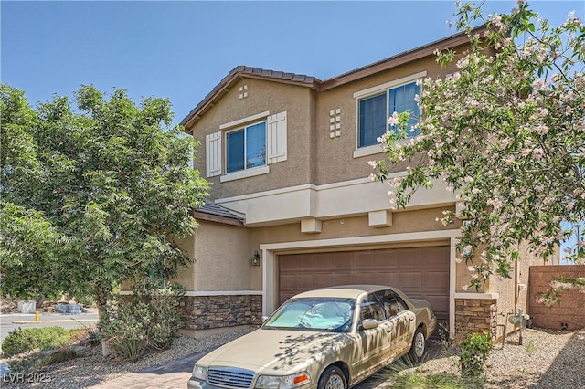 4902 Guysborough St, Las Vegas, NV 89148 - view of property featuring stone siding, stucco siding, and a garage
