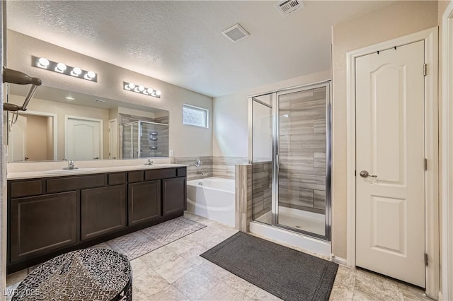 4902 Guysborough St, Las Vegas, NV 89148 - full bath featuring a shower stall, a garden tub, double vanity, and a textured ceiling