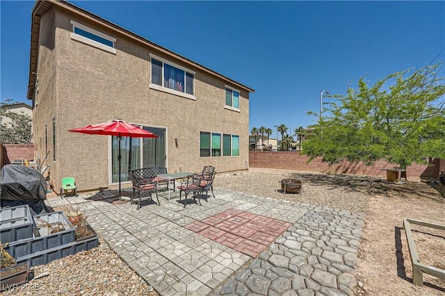 4902 Guysborough St, Las Vegas, NV 89148 - back of house featuring stucco siding, a fenced backyard, and a patio