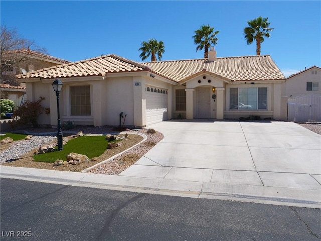 6508 Alpine Forest Ct, Las Vegas, NV 89149 - mediterranean / spanish-style house featuring stucco siding, a tile roof, a garage, and driveway