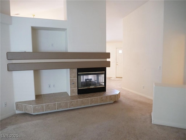 6508 Alpine Forest Ct, Las Vegas, NV 89149 - unfurnished living room featuring carpet flooring, baseboards, and a tile fireplace