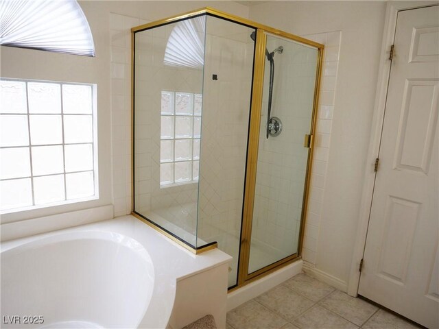 6508 Alpine Forest Ct, Las Vegas, NV 89149 - bathroom featuring a shower stall, a garden tub, and tile patterned flooring