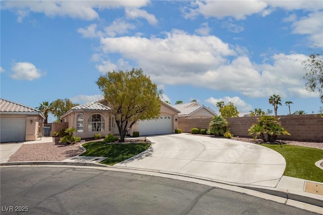 view of front of house with stucco siding, fence, a garage, a tile roof, and driveway