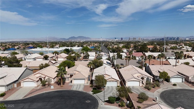 birds eye view of property with a mountain view and a residential view