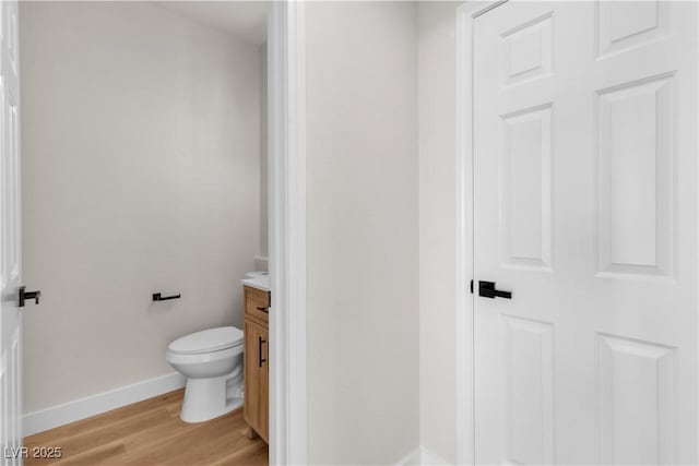 10613 Turquoise Valley Dr, Las Vegas, NV 89144 - bathroom featuring toilet, baseboards, vanity, and wood finished floors