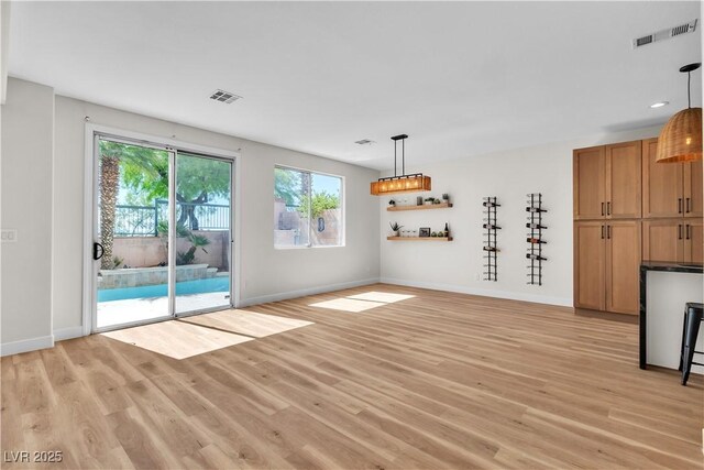 10613 Turquoise Valley Dr, Las Vegas, NV 89144 - unfurnished dining area featuring light wood-type flooring, visible vents, and baseboards