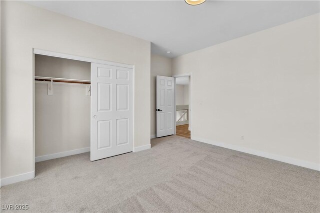 10613 Turquoise Valley Dr, Las Vegas, NV 89144 - unfurnished bedroom featuring a closet, baseboards, and carpet floors