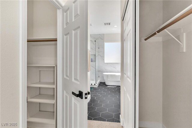 10613 Turquoise Valley Dr, Las Vegas, NV 89144 - spacious closet featuring visible vents and tile patterned flooring