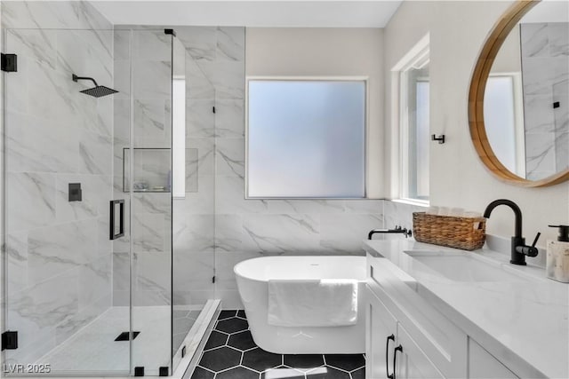 10613 Turquoise Valley Dr, Las Vegas, NV 89144 - full bathroom with vanity, tile walls, a marble finish shower, and a freestanding tub