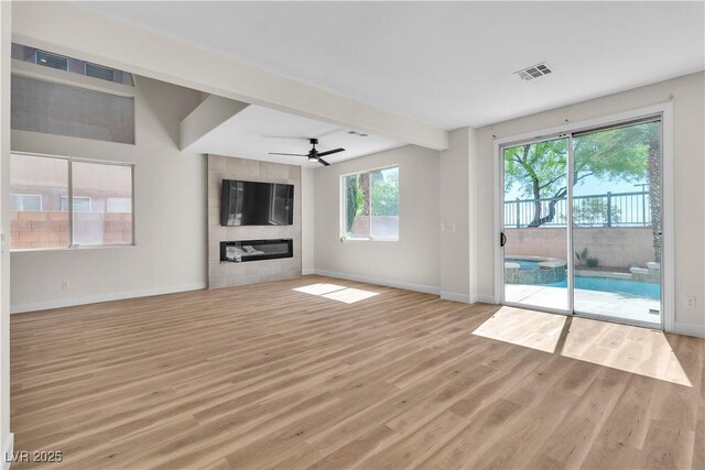 10613 Turquoise Valley Dr, Las Vegas, NV 89144 - unfurnished living room featuring baseboards, light wood-style flooring, visible vents, and a ceiling fan