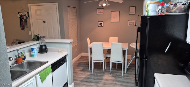 8070 W Russell Rd Unit 1105, Las Vegas, NV 89113 - kitchen featuring wood finished floors, freestanding refrigerator, ceiling fan, dishwasher, and a sink