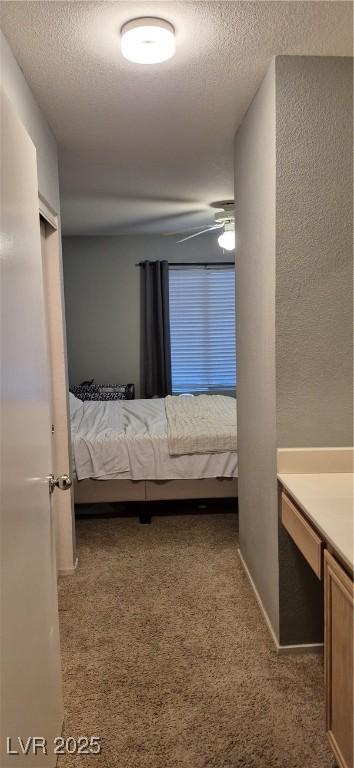 8070 W Russell Rd Unit 1105, Las Vegas, NV 89113 - unfurnished bedroom with a textured ceiling and carpet flooring