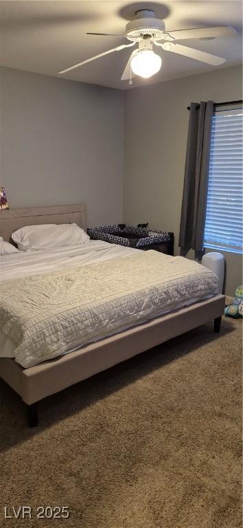 8070 W Russell Rd Unit 1105, Las Vegas, NV 89113 - bedroom with a ceiling fan and carpet floors