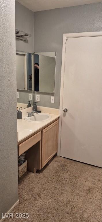 8070 W Russell Rd Unit 1105, Las Vegas, NV 89113 - bathroom featuring a textured wall and vanity