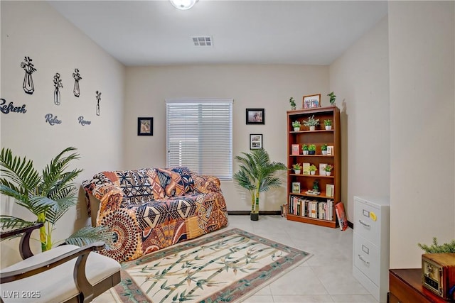 sitting room featuring visible vents and light tile patterned floors