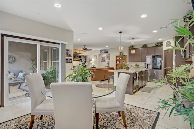dining space with recessed lighting, ceiling fan, and light tile patterned flooring
