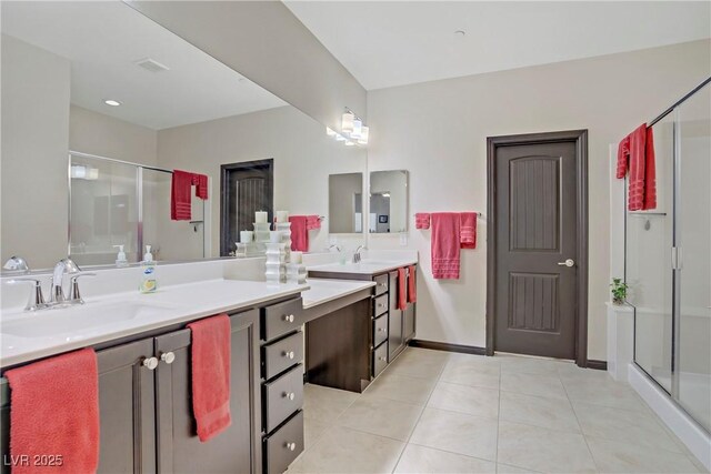 full bath with vanity, tile patterned flooring, a stall shower, and baseboards