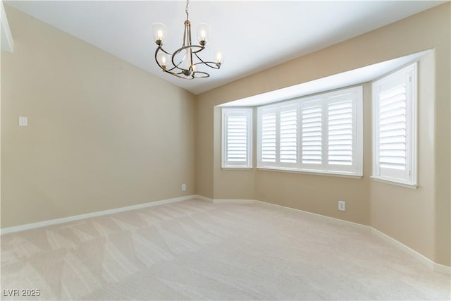 5005 Chambliss Dr, Las Vegas, NV 89130 - spare room with a chandelier, light carpet, and baseboards
