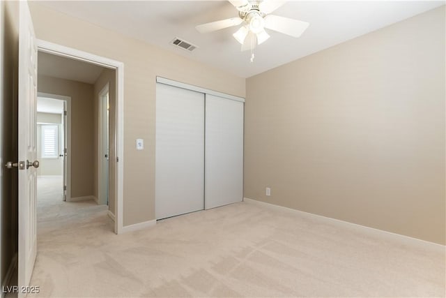 5005 Chambliss Dr, Las Vegas, NV 89130 - unfurnished bedroom with light carpet, a closet, ceiling fan, and baseboards