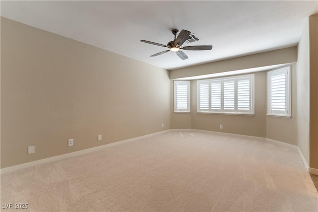 5005 Chambliss Dr, Las Vegas, NV 89130 - spare room featuring light colored carpet, ceiling fan, and baseboards