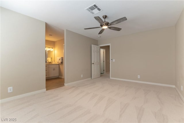 5005 Chambliss Dr, Las Vegas, NV 89130 - unfurnished bedroom with light colored carpet, baseboards, ensuite bath, and a ceiling fan