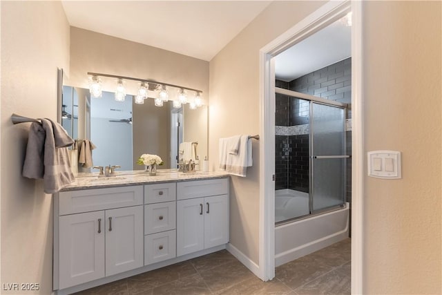 5005 Chambliss Dr, Las Vegas, NV 89130 - full bathroom featuring double vanity, combined bath / shower with glass door, and baseboards