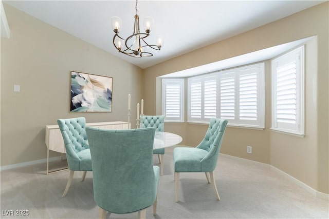5005 Chambliss Dr, Las Vegas, NV 89130 - dining room with a chandelier, light carpet, baseboards, and vaulted ceiling