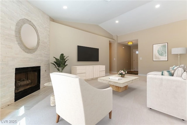 5005 Chambliss Dr, Las Vegas, NV 89130 - living area with vaulted ceiling, light colored carpet, a fireplace, recessed lighting, and baseboards
