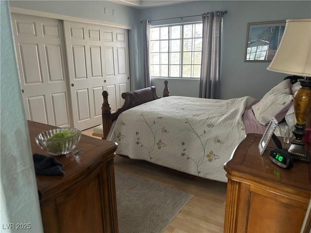 bedroom with a closet and light wood-type flooring