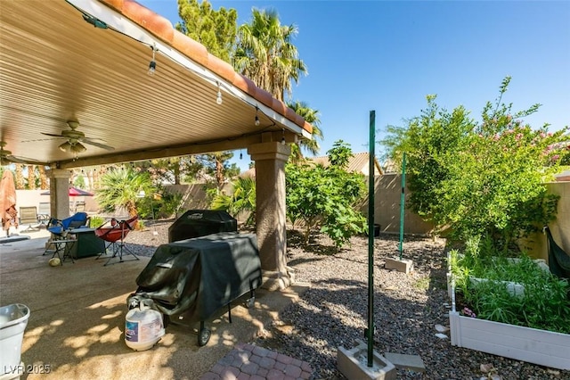 1048 Painted Daisy Ave, Henderson, NV 89074 - fenced backyard with ceiling fan, a patio, outdoor dining area, and a grill