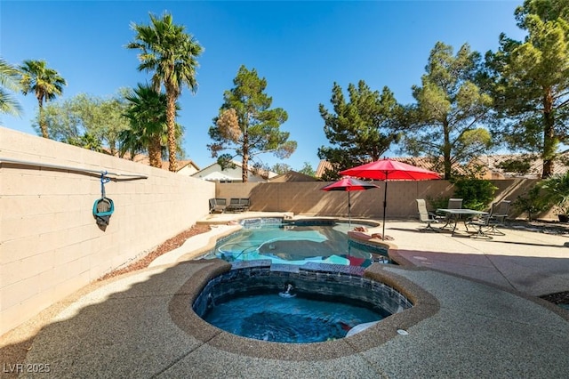 1048 Painted Daisy Ave, Henderson, NV 89074 - view of pool with a patio area, a fenced backyard, and a pool with connected hot tub