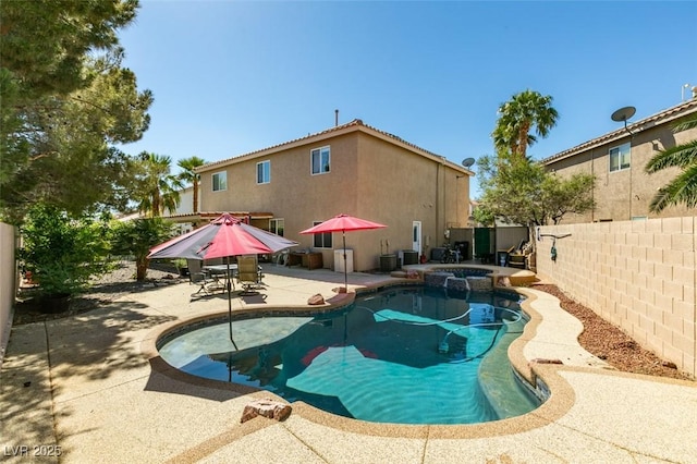 1048 Painted Daisy Ave, Henderson, NV 89074 - view of swimming pool with a fenced backyard, a patio area, and a pool with connected hot tub