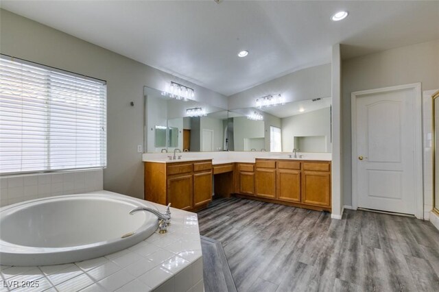 1048 Painted Daisy Ave, Henderson, NV 89074 - full bath featuring a bath, double vanity, wood finished floors, recessed lighting, and a shower with door