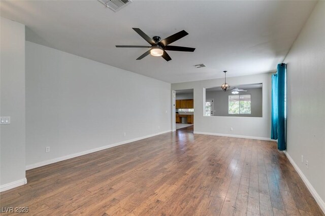 1048 Painted Daisy Ave, Henderson, NV 89074 - spare room featuring a ceiling fan and dark wood finished floors