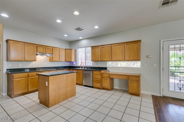 1048 Painted Daisy Ave, Henderson, NV 89074 - kitchen featuring stainless steel appliances, healthy amount of natural light, a center island, dark countertops, and recessed lighting