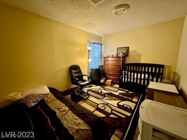 bedroom featuring a textured ceiling