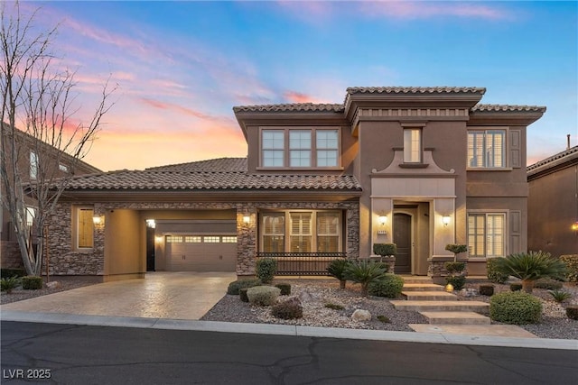 2717 Mona Lisa St, Henderson, NV 89044 - mediterranean / spanish-style house with driveway, an attached garage, a porch, stone siding, and a tiled roof
