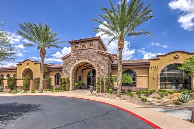 2717 Mona Lisa St, Henderson, NV 89044 - view of front of property featuring stucco siding, a tiled roof, and stone siding