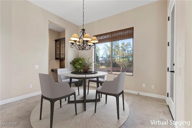 2717 Mona Lisa St, Henderson, NV 89044 - dining space with a chandelier, baseboards, and light tile patterned floors