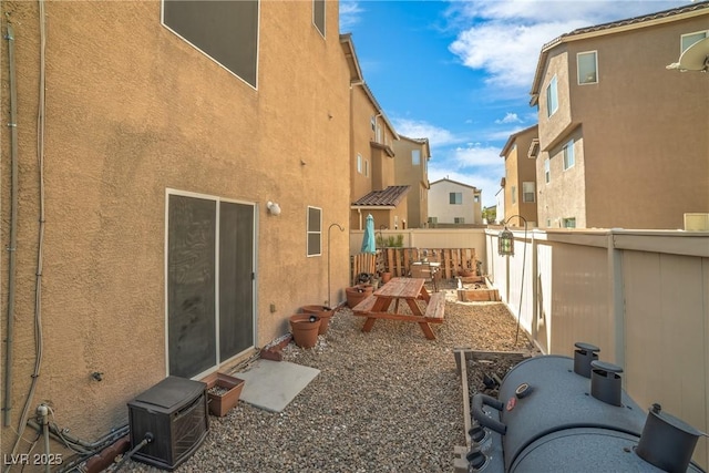 exterior space with fence and a residential view