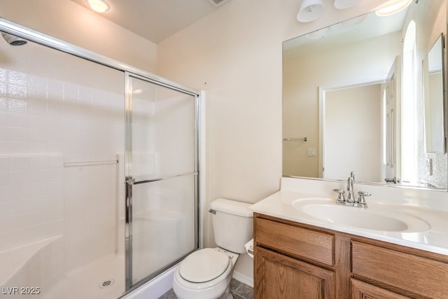 full bath featuring a shower stall, toilet, and vanity