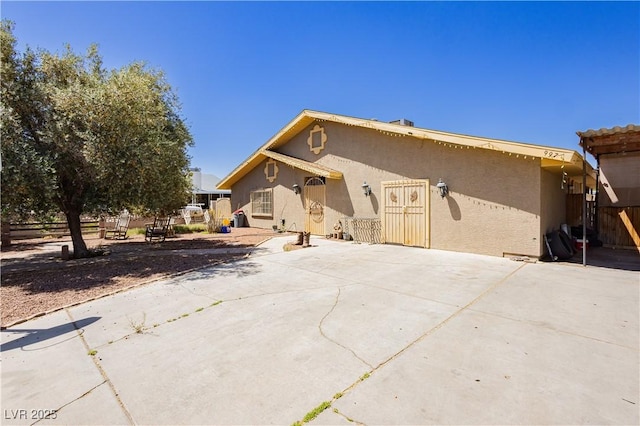 997 N Christy Ln, Las Vegas, NV 89110 - view of front of home featuring stucco siding and a patio area