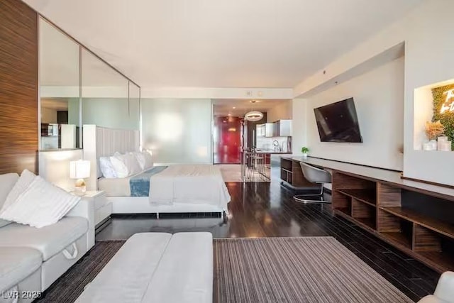 bedroom with wood finished floors