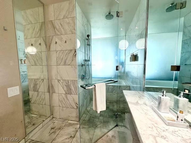 full bathroom with vanity and a stall shower
