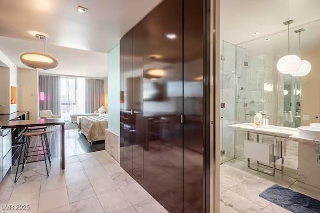bathroom featuring radiator and a shower stall