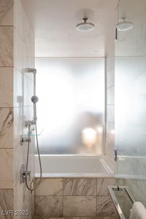 full bathroom featuring tiled bath and tiled shower
